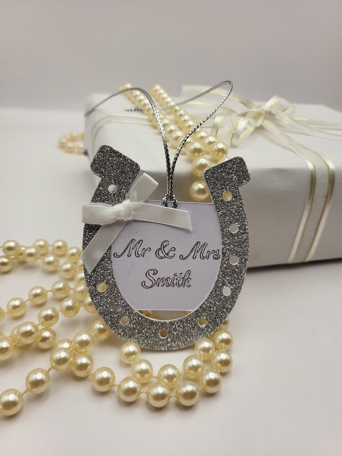 silver glitter card horseshoe shape gift tag.   
