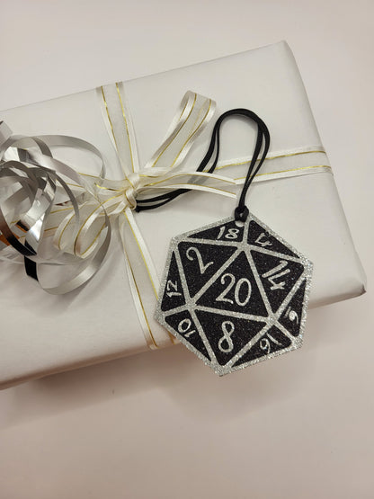 Glitter 20 sided gaming dice. Black background  with silver numbers. Ideal for gaming enthusiasts