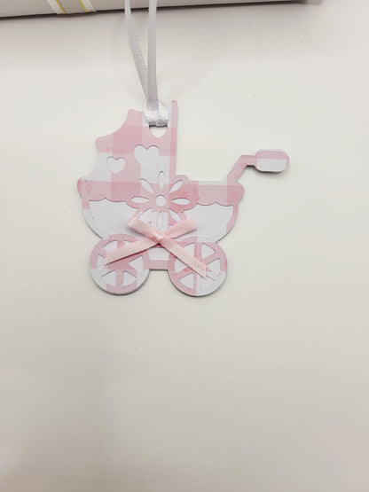 Pink gingham pram shaped gift tag. This tag has a pink bow, and a white satin ribbon to attach to your gift