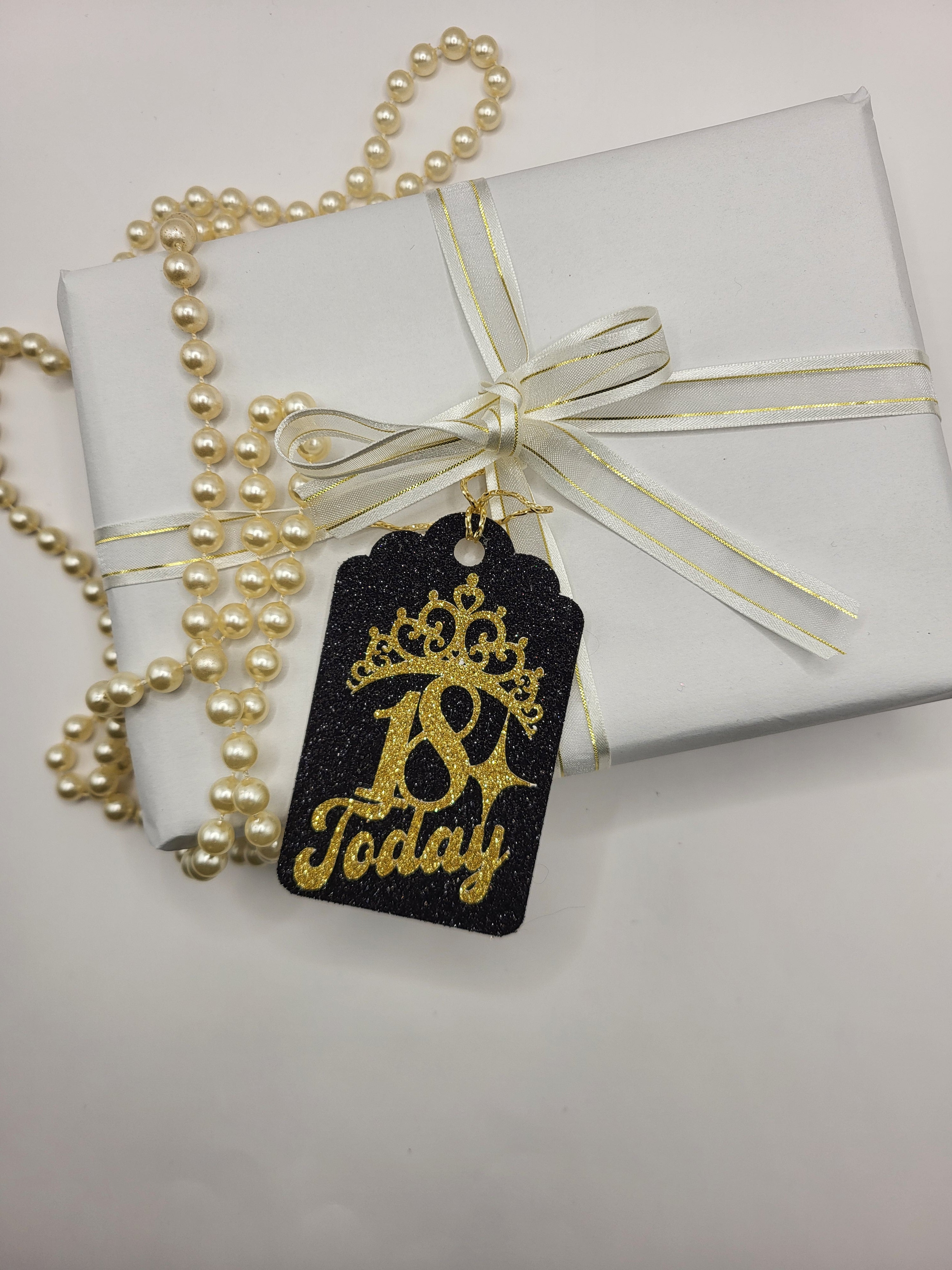 Milestone Age gift tag is made from black glitter card with the age 18 and tiara stuck on the front in gold glitter card
