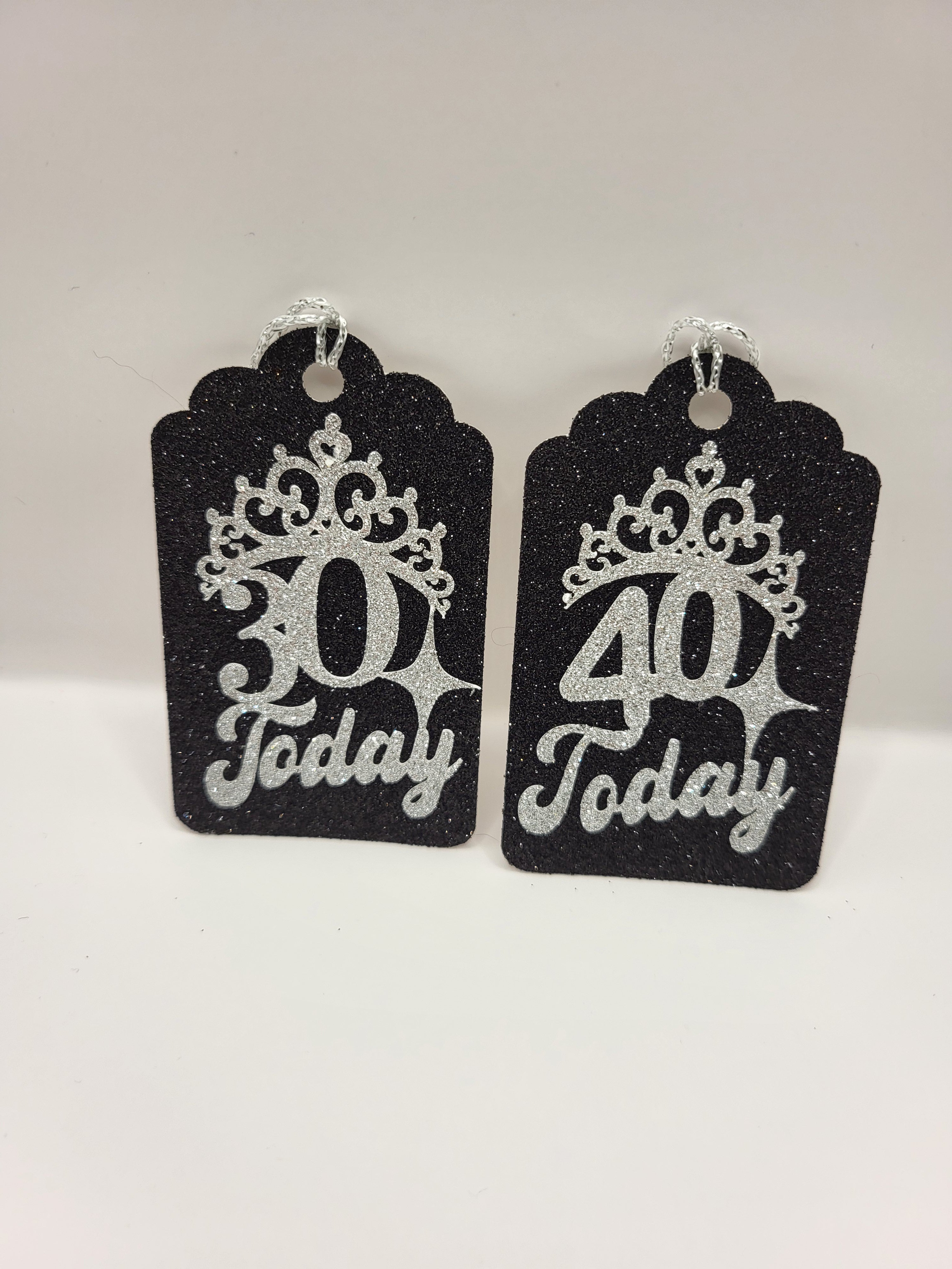 Milestone Age gift tags are made from black glitter card with the ages 30 and 40 with tiaras stuck on the fronts in silver glitter card