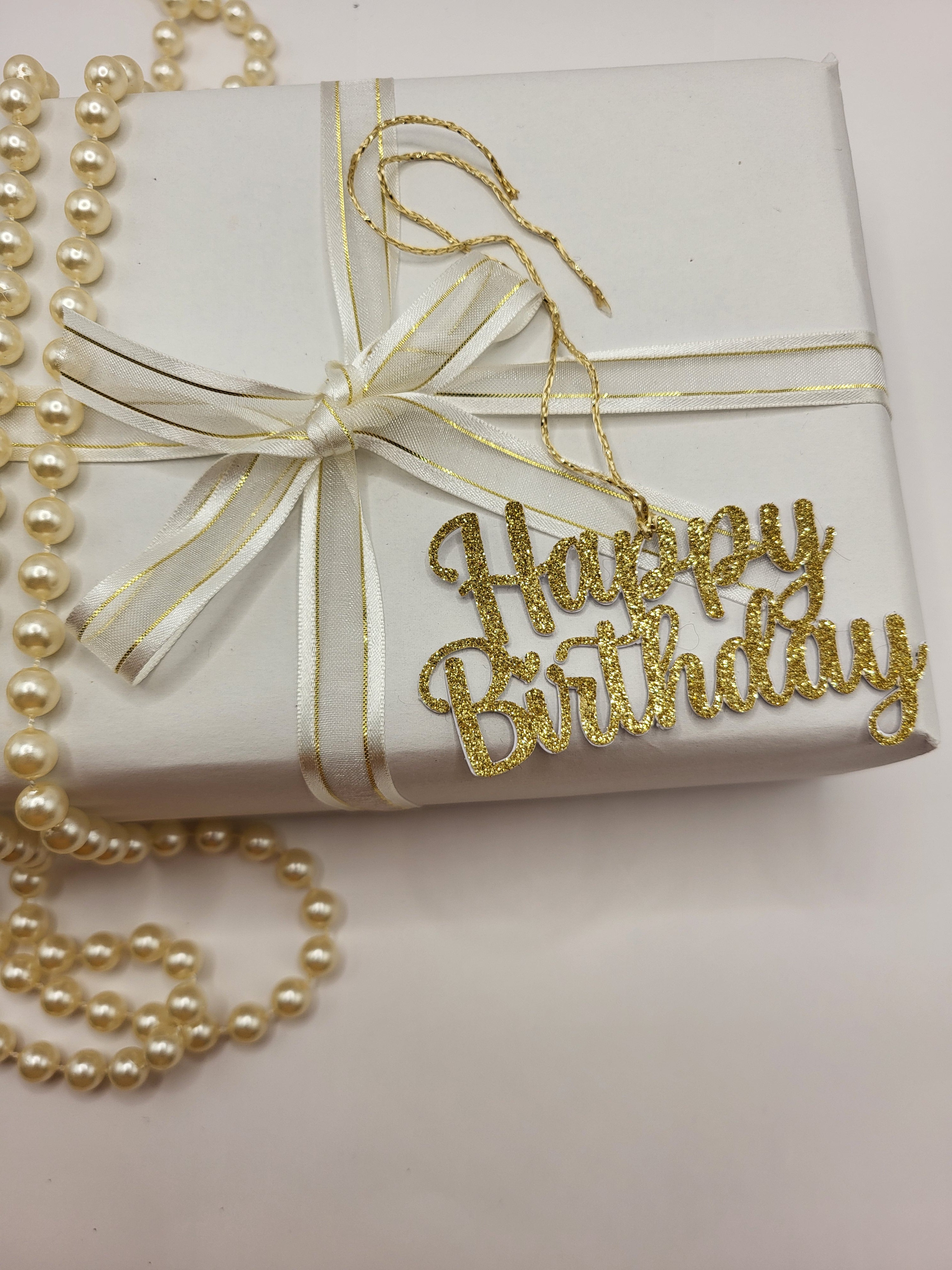 Decorative gold glitter happy birthday gift tag is for decorative purpose only. This tag cannot be written on because it is the words happy birthday only