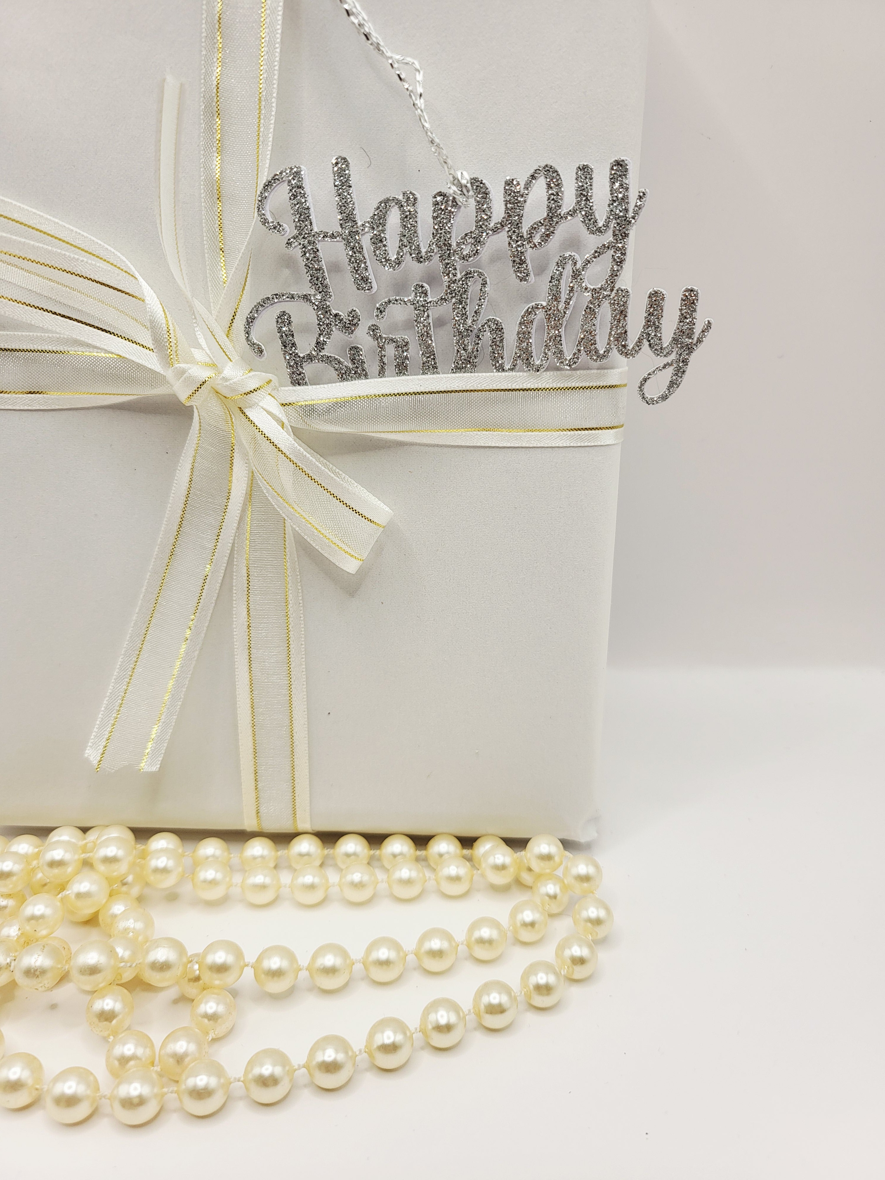 Decorative silver glitter happy birthday gift tag is for decorative purpose only. This tag cannot be written on because it is the words happy birthday only